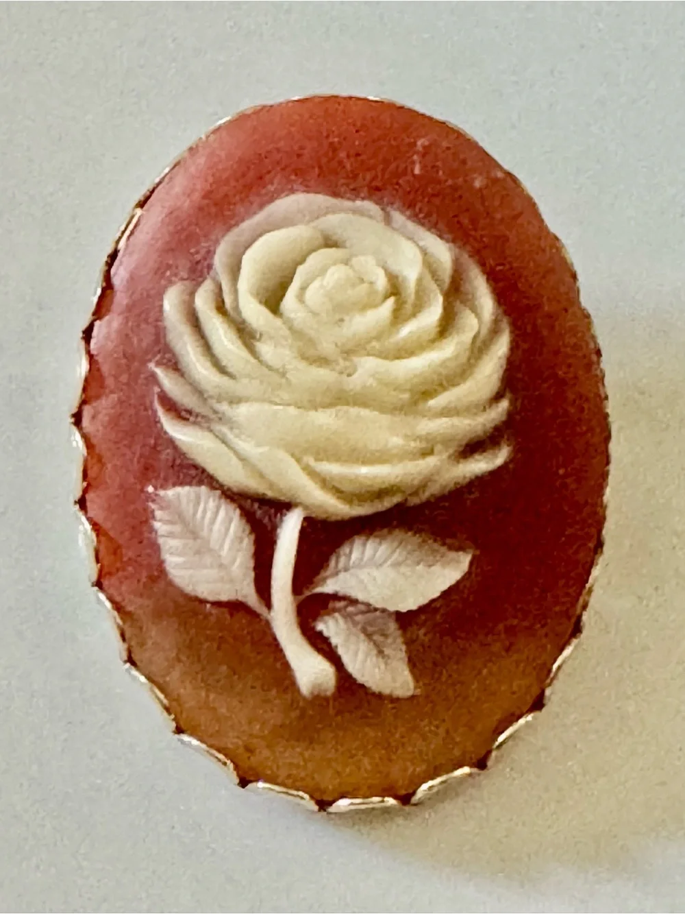 Vintage Cameo Rose Brooch in Cream on Gold Background